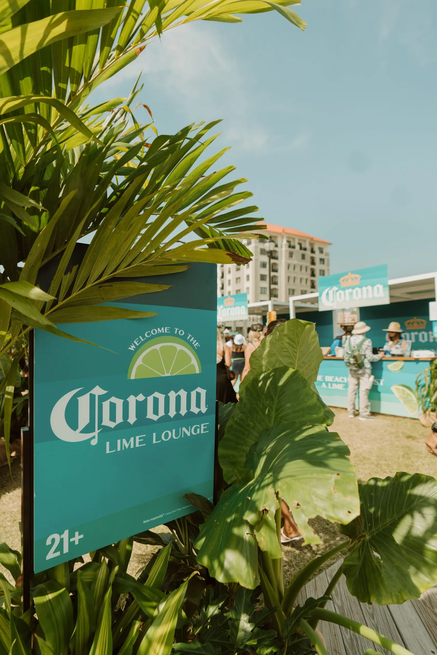Corona | Sea Hear Now — Lime Lounge welcome sign among palms at the festival activation