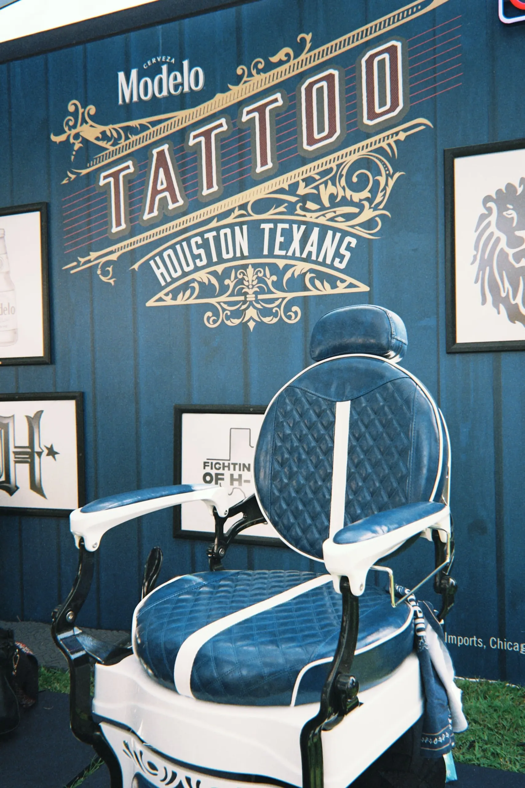 Modelo | Houston Texans — vintage barber chair in front of the Modelo Tattoo backwall
