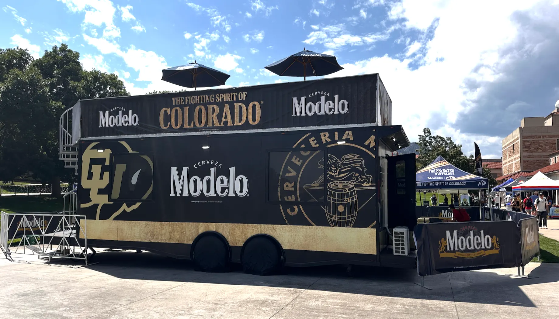 Modelo | University of Colorado — wrapped double-deck trailer on site at the CU season opener