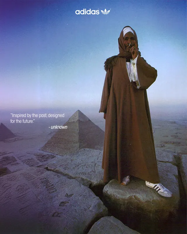 Adidas mock campaign — a robed figure in white Adidas sneakers atop the Pyramids of Giza, captioned “Inspired by the past, designed for the future.”